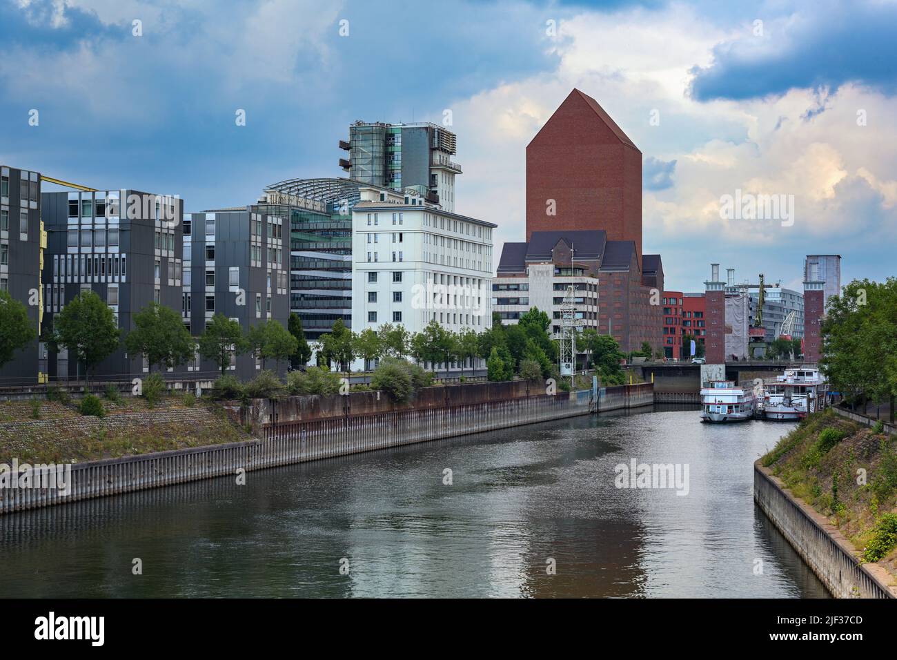 Inner harbor of Duisburg, Germany with the State archive of North Rhine-Westphalia, the monumental tower building of red brick without windows was a f Stock Photo
