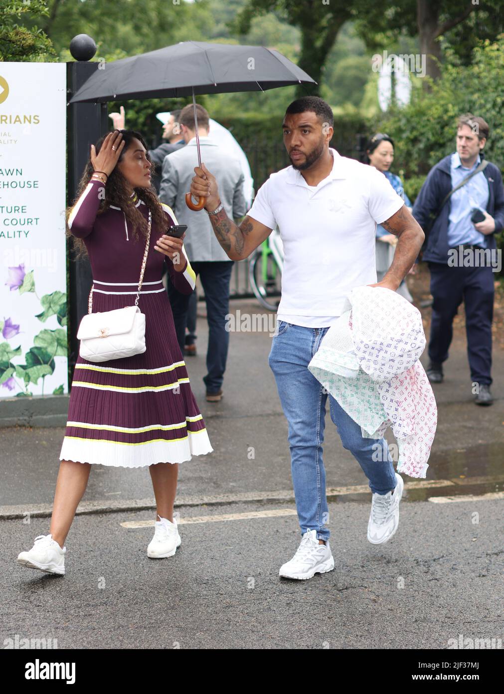 Birmingham City Striker Troy Deeney and Alisha Hosannah arriving at day three of the 2022 Wimbledon Championships at the All England Lawn Tennis and Croquet Club, Wimbledon. Stock Photo