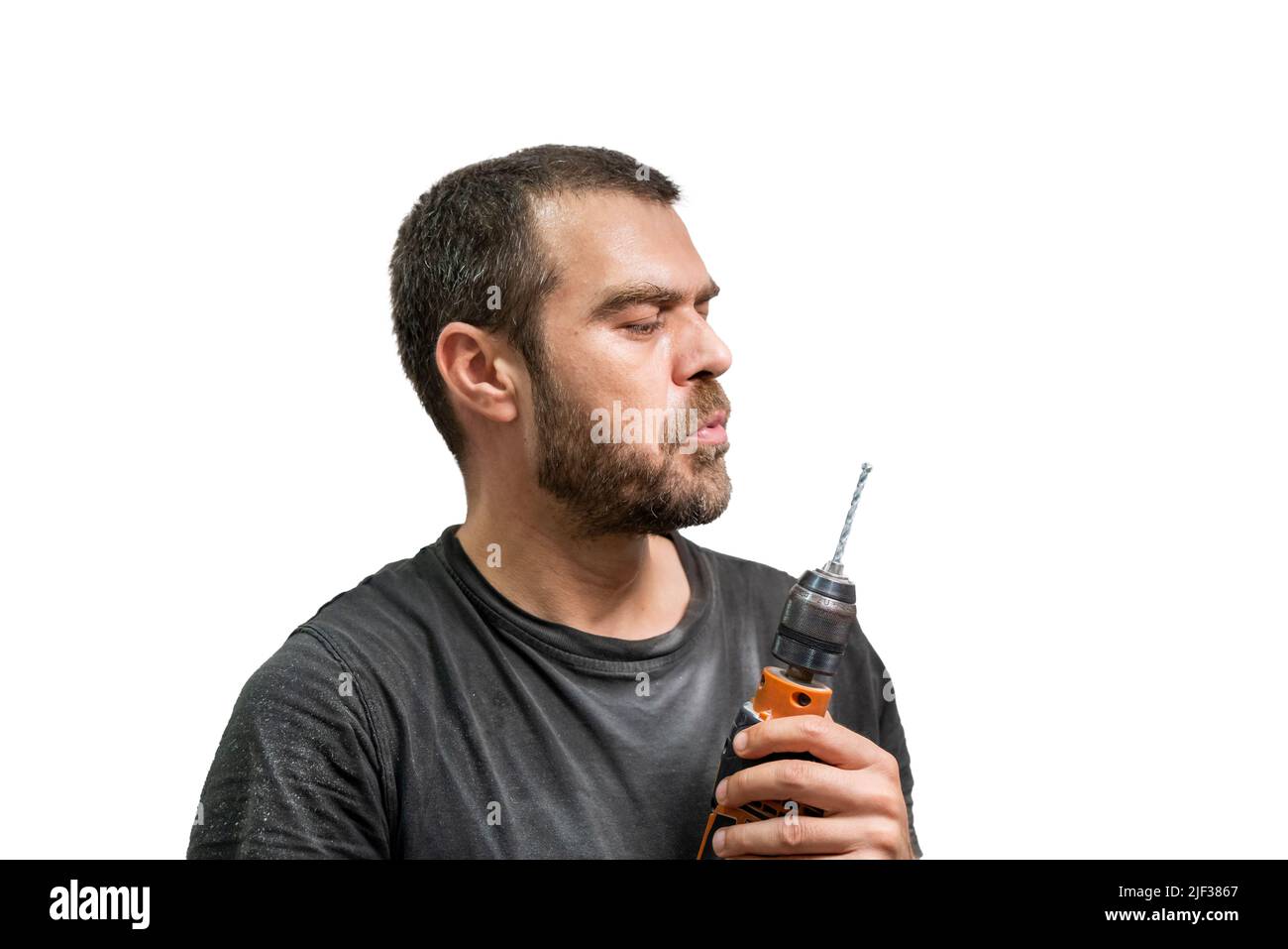 Selective focus shot of man posing with drill. Stock Photo