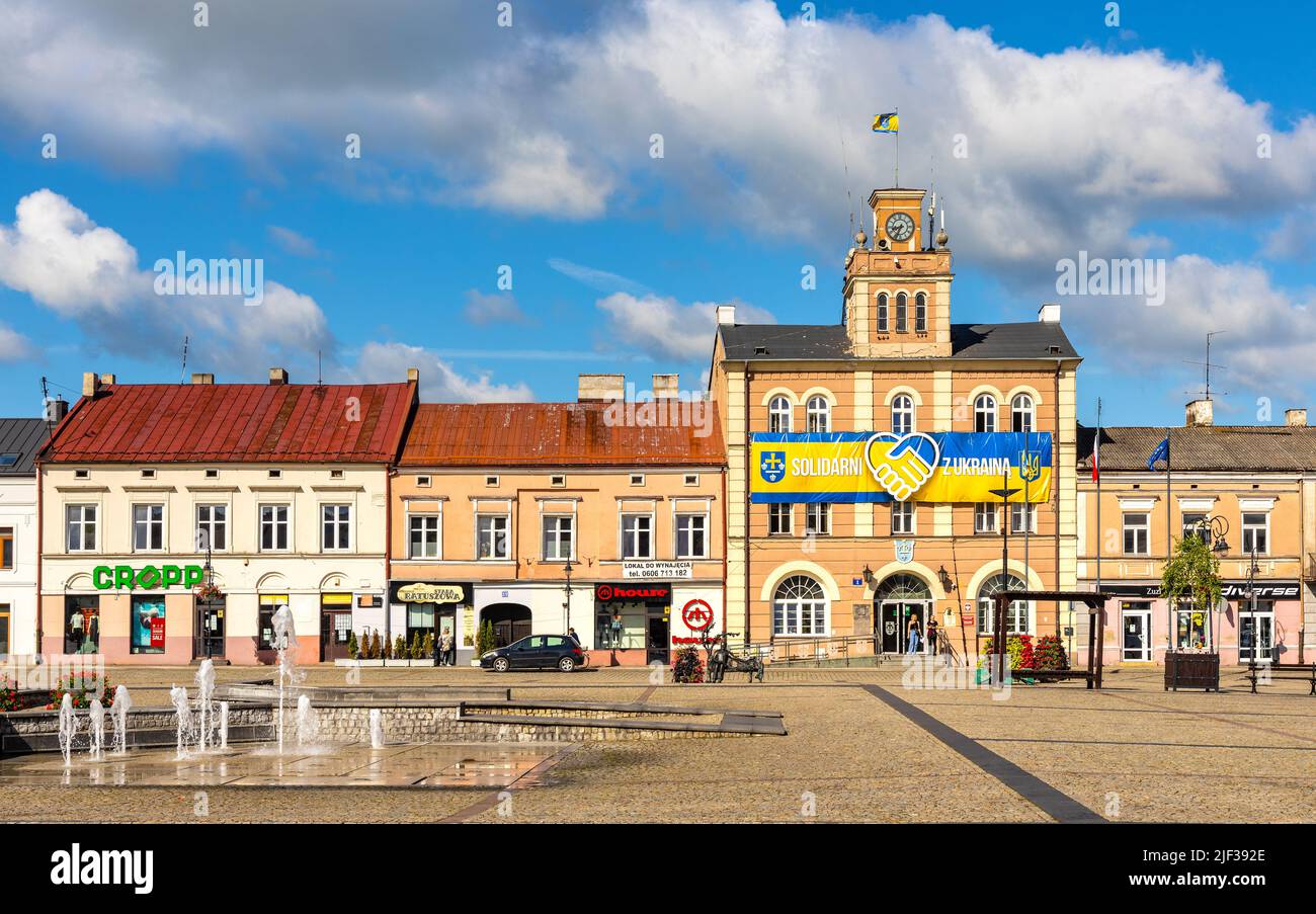 Skierniewice, Poland - June 14, 2022: Main Market Square Rynek with historic Town Hall palace and tenement houses in old town city center Stock Photo