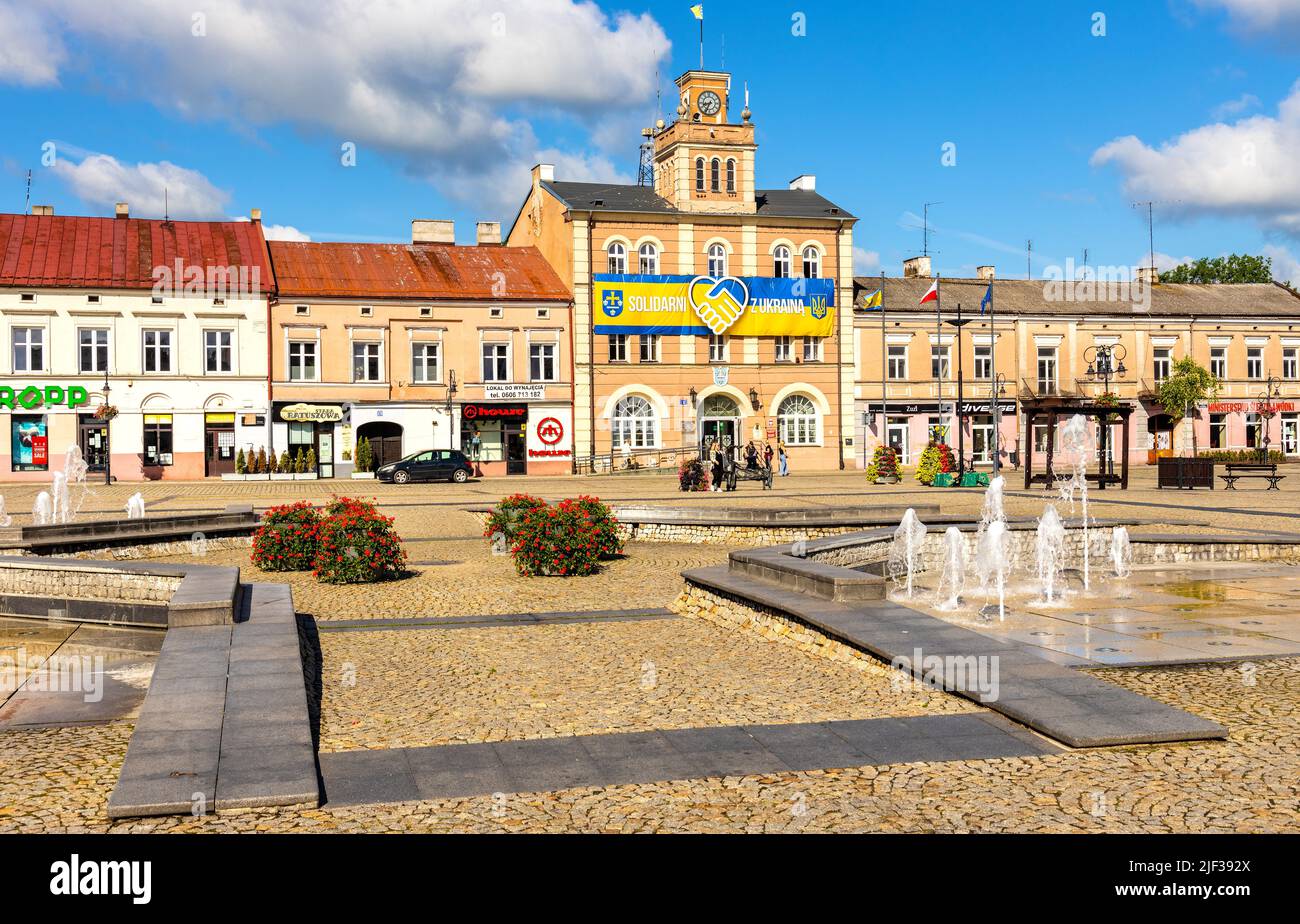 Skierniewice, Poland - June 14, 2022: Main Market Square Rynek with historic Town Hall palace and tenement houses in old town city center Stock Photo