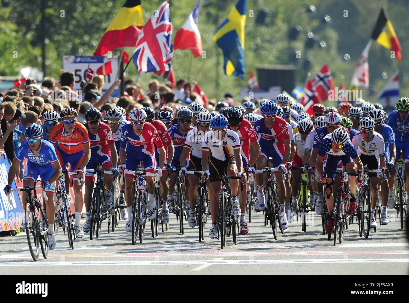 File photo dated 25-09-2011 of Great Britain's Bradley Wiggins (left of centre with Union Jack on helmet) with Mark Cavendish on his left and David Millar (blue helmet) as they lead the field in the Men's Elite Road race during Day Seven of the UCI Road Race World Championships, Copenhagen. Originally due to host the Grand Depart last year before the Covid-19 pandemic intervened, 12 months later Denmark will be the starting point for a 3,328km race that will then head across the north of France, into the Alps and then to the Pyrenees before the traditional finish in Paris. Issue date: Wednesda Stock Photo