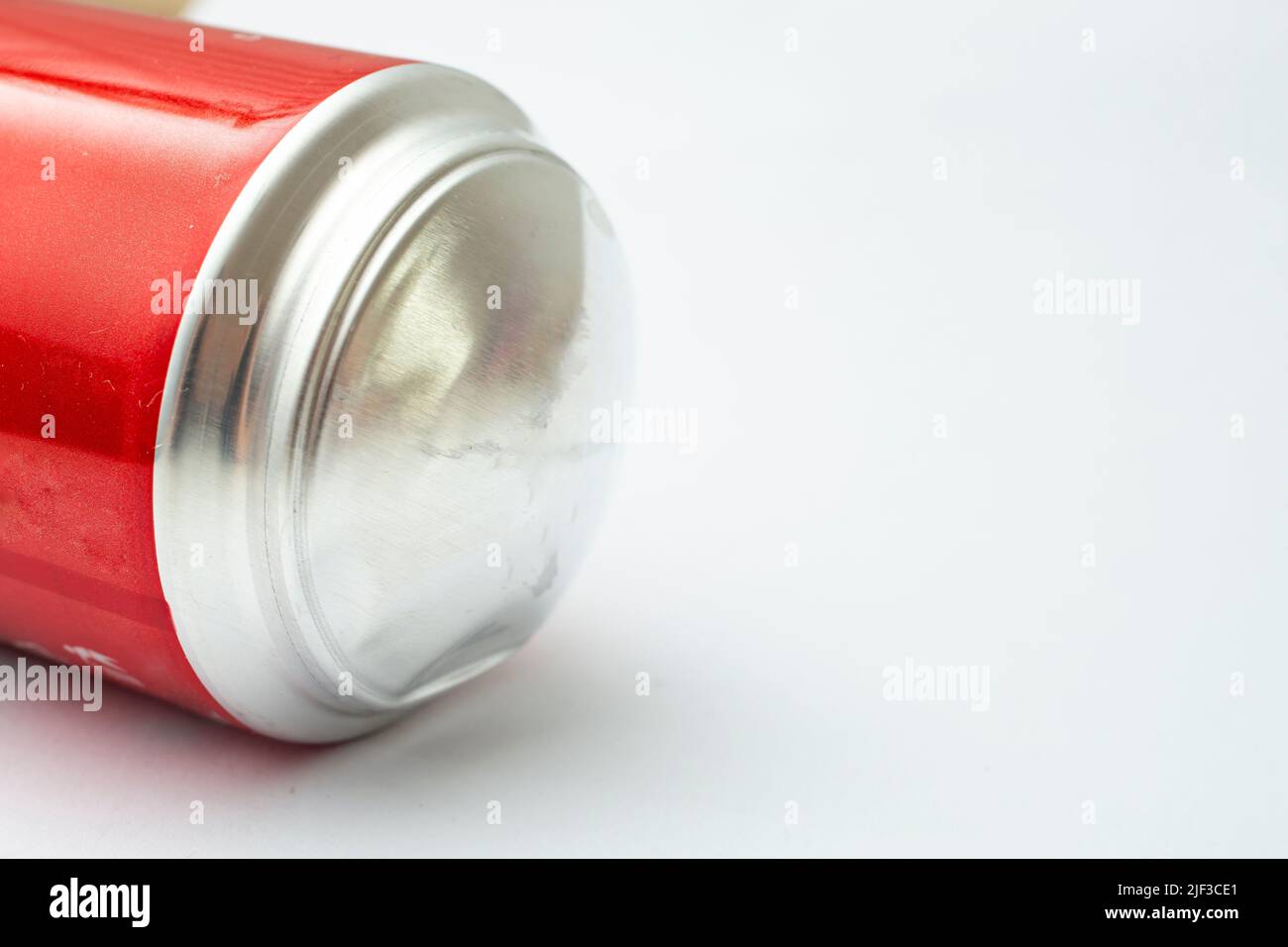 Bulging soda can bottom, isolated on white background, close up Stock Photo