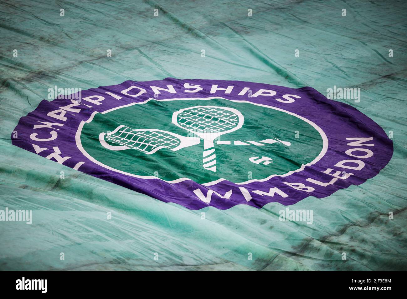 London, UK. 29th June, 2022. Tennis: Grand Slam/WTA Tour/ATP Tour - Wimbledon. The tournament logo is printed on a rain tarp. Credit: Frank Molter/dpa/Alamy Live News Stock Photo