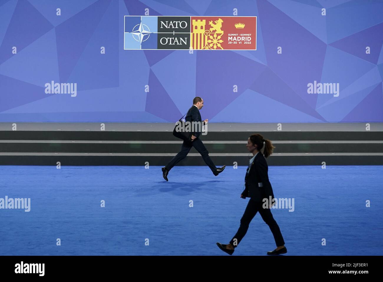 Madrid, Spain. 29th June, 2022. A delegate dashes to a meeting as NATO heads of state and governments hold a NATO summit in Madrid, Spain, Wednesday, June 29, 2022. Photo by Paul Hanna/UPI Credit: UPI/Alamy Live News Stock Photo