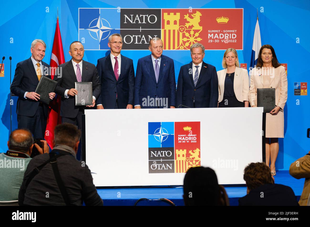 Madrid, Spain. 29th June, 2022. Pekka Haavisto, Minister of Foreign Affairs of Finland, Mevlut Cavusoglu, Minister of Foreign Affairs of Turkey, NATO Secretary-General Jens Stoltenberg, President Recep Tayyip Erdogan of Turkey, President Sauli Niinisto of Finland, and Prime Minister Magdalena Andersson of Sweden and Ann Linde of Minister of Foreign Affairs of Sweden, during a signing ceremony on Tuesday, June 28, 2022, paving the way for Finnish and Swedish NATO membership. Photo via NATO/UPI Credit: UPI/Alamy Live News Stock Photo