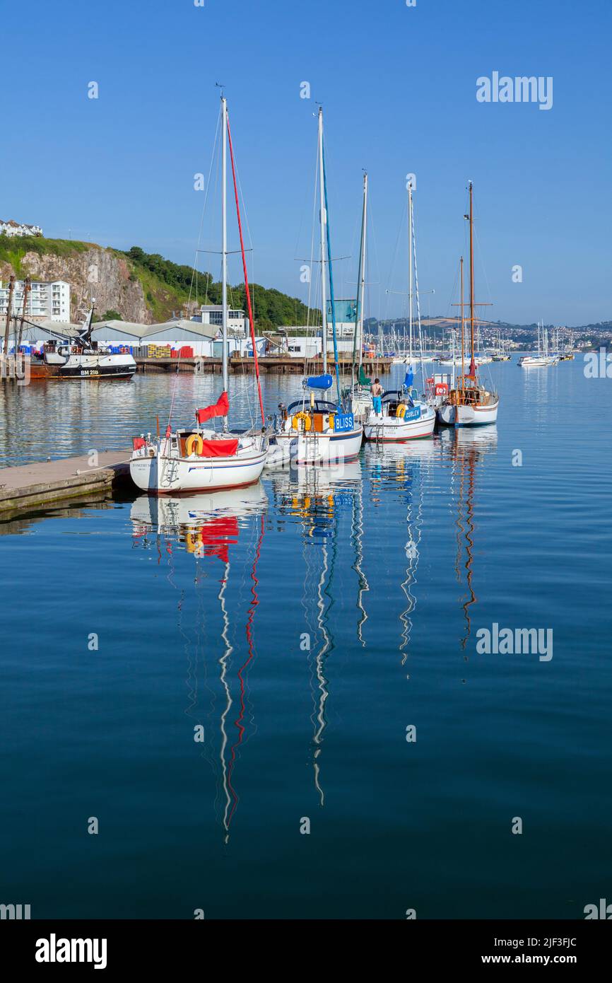 Europe, UK, England, Devon, Torbay, Brixham Marina with Four Yachts Moored to Floating Piers Stock Photo