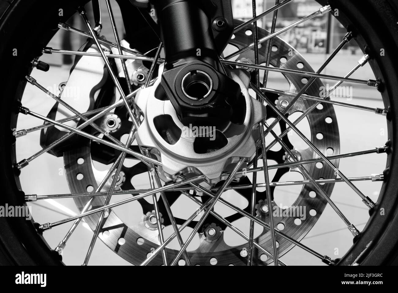 Bike. Wheel close-up. Spokes, rim, brake pads and disc. Monochrome image Stock Photo