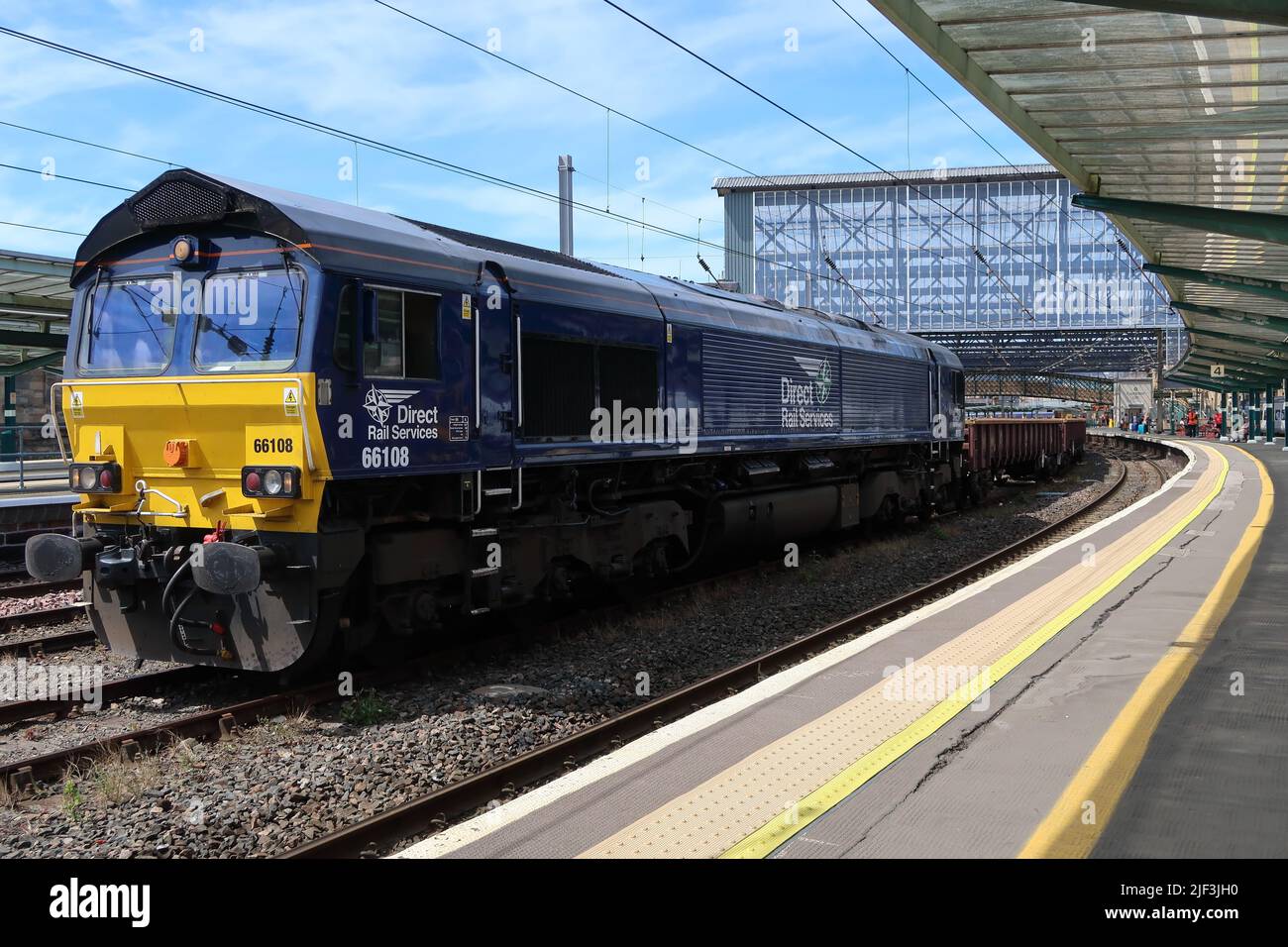 DRS class 66 locomotive No 66108 standing in the centre line at Carlisle Citadel station with a short freight train on 15th June 2022. Stock Photo
