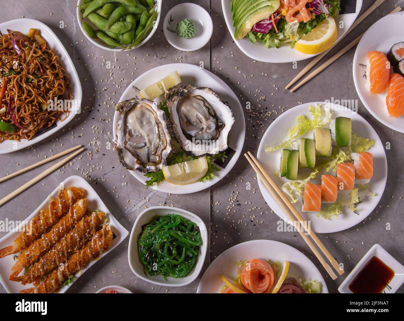 Oyster plate in the middle of the Japanese cuisine table Stock Photo