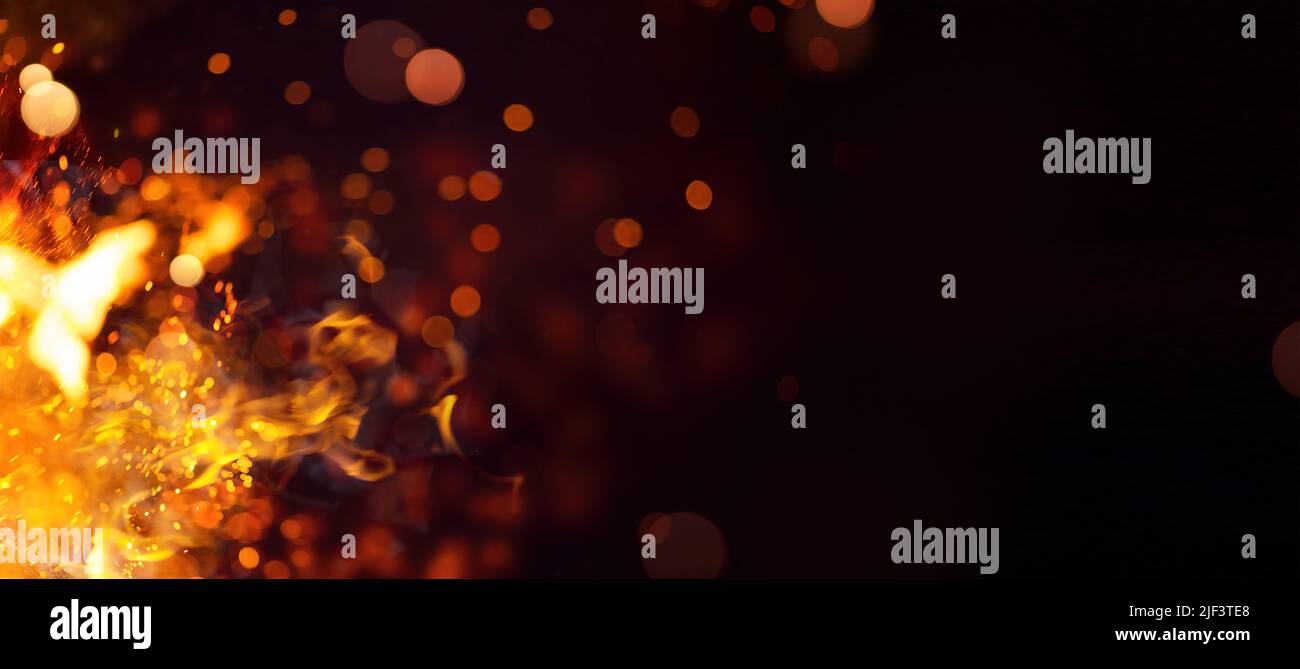 abstract fire flames with sparks on a black background Stock Photo - Alamy