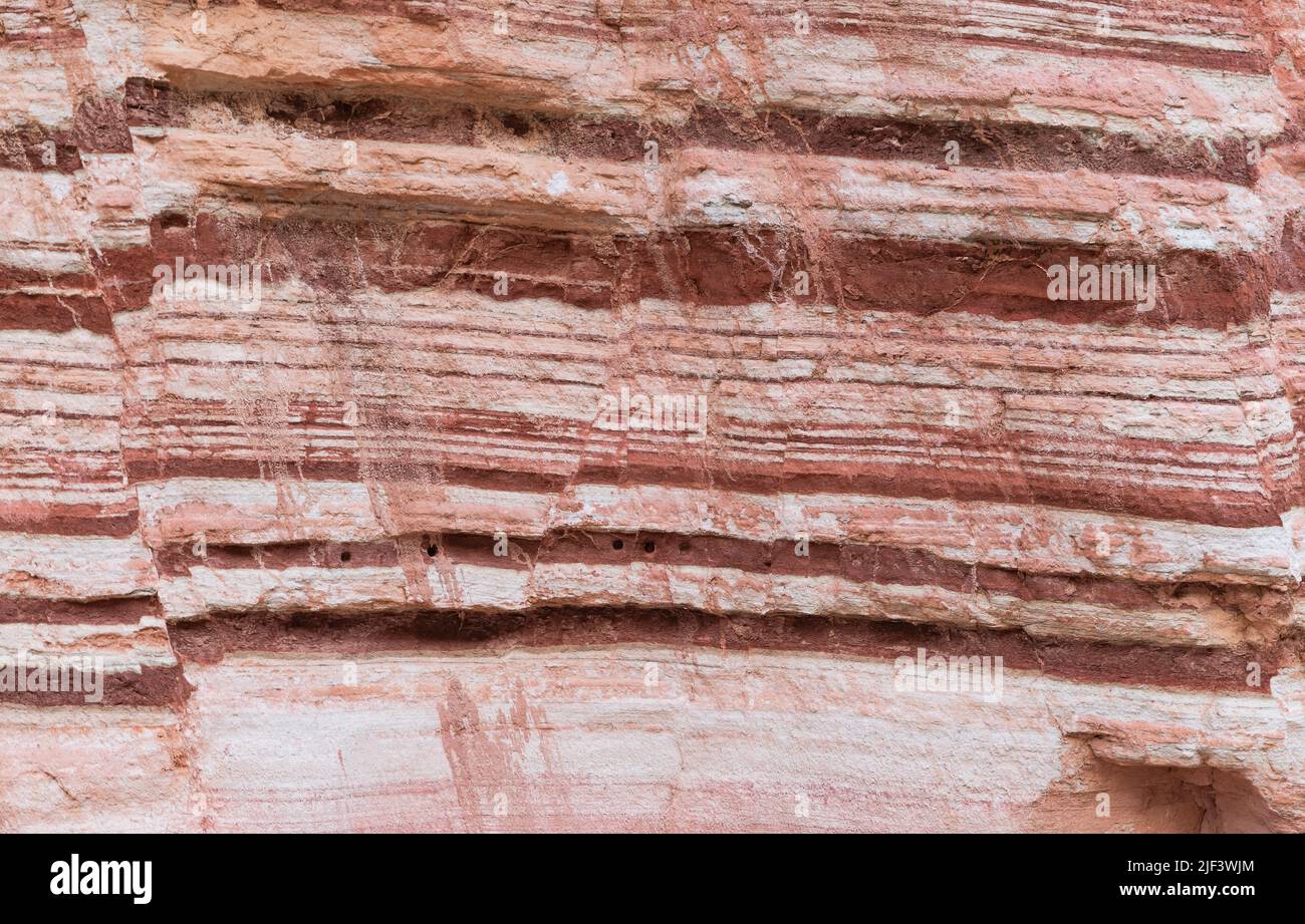beautiful rock from colored layers background Stock Photo