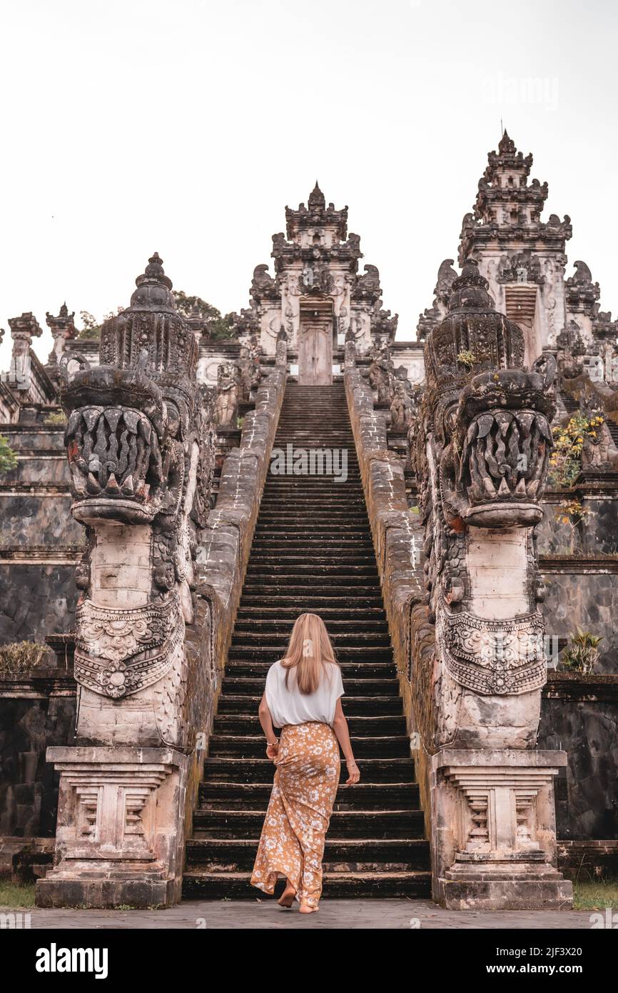 Beautiful woman in sarong climbing the Lempuyang Temple stairs of Bali,  Indonesia Stock Photo - Alamy
