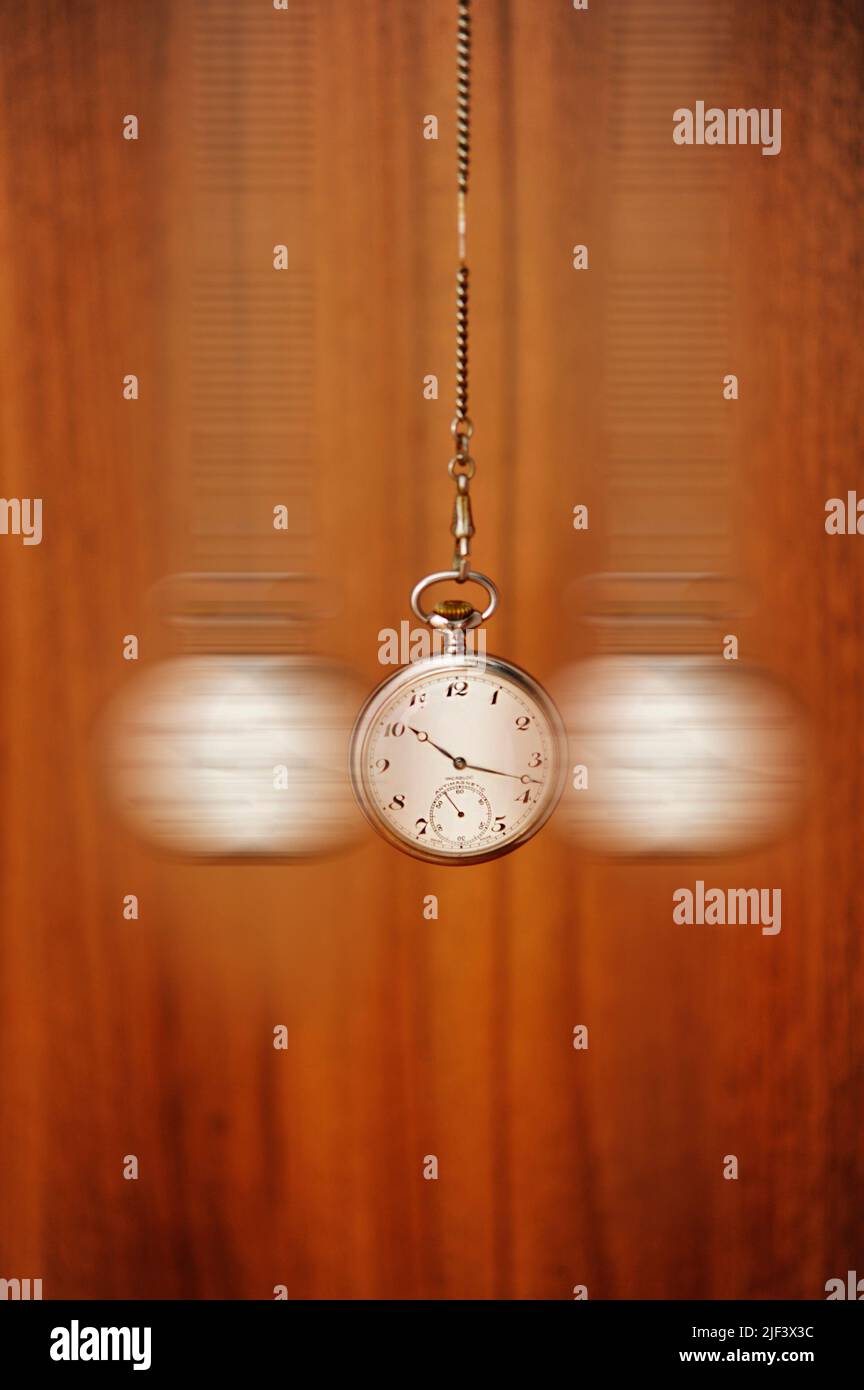 pocket watch swinging, hypnosis concept Stock Photo