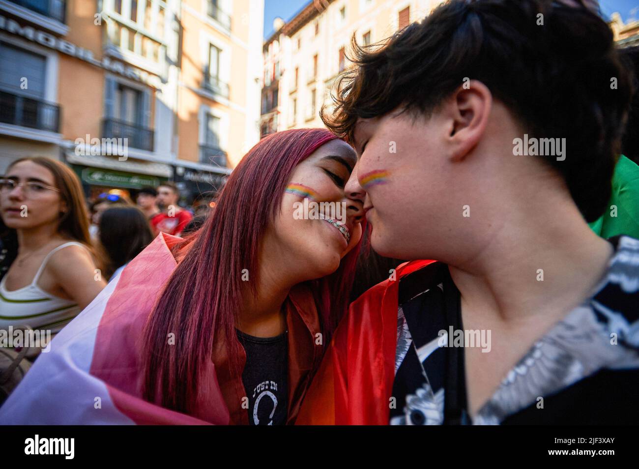 Pamplona, Spain. 28th June, 2022. Two girls kiss during the Gay Pride celebration in Pamplona. Hundreds of people demonstrated through the streets of Pamplona, on the occasion of the celebration of Gay Pride, drag queens, flags flowed on the streets in vindication of the rights of the LGTBQ   collective. (Photo by Elsa A Bravo/SOPA Images/Sipa USA) Credit: Sipa USA/Alamy Live News Stock Photo