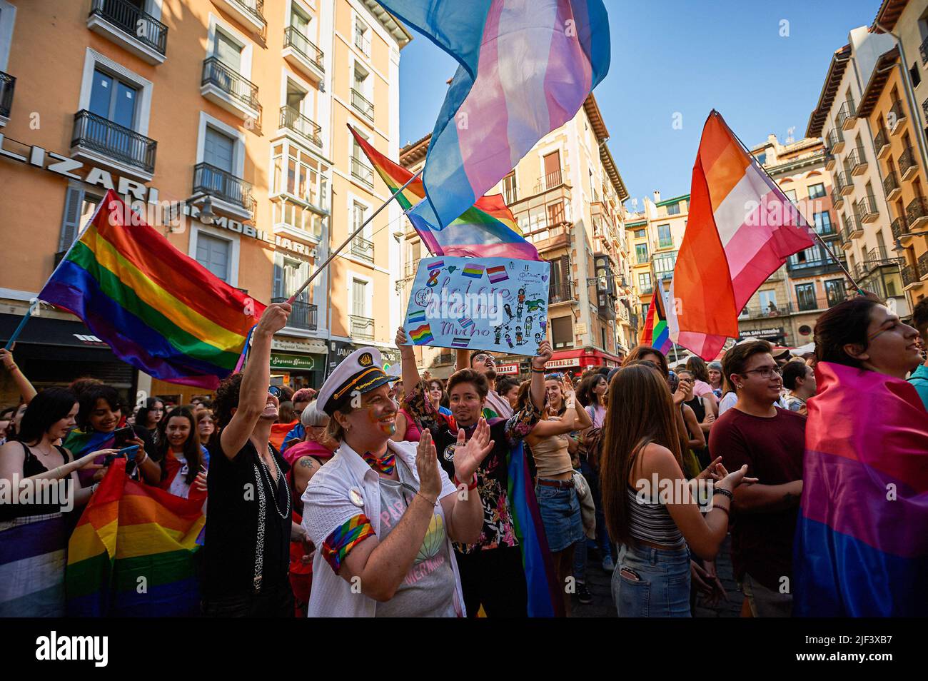 Pamplona, Spain. 28th June, 2022. Demonstrators celebrate with flags and placards during the Gay Parade on the streets of Pamplona. Hundreds of people demonstrated through the streets of Pamplona, on the occasion of the celebration of Gay Pride, drag queens, flags flowed on the streets in vindication of the rights of the LGTBQ   collective. (Photo by Elsa A Bravo/SOPA Images/Sipa USA) Credit: Sipa USA/Alamy Live News Stock Photo
