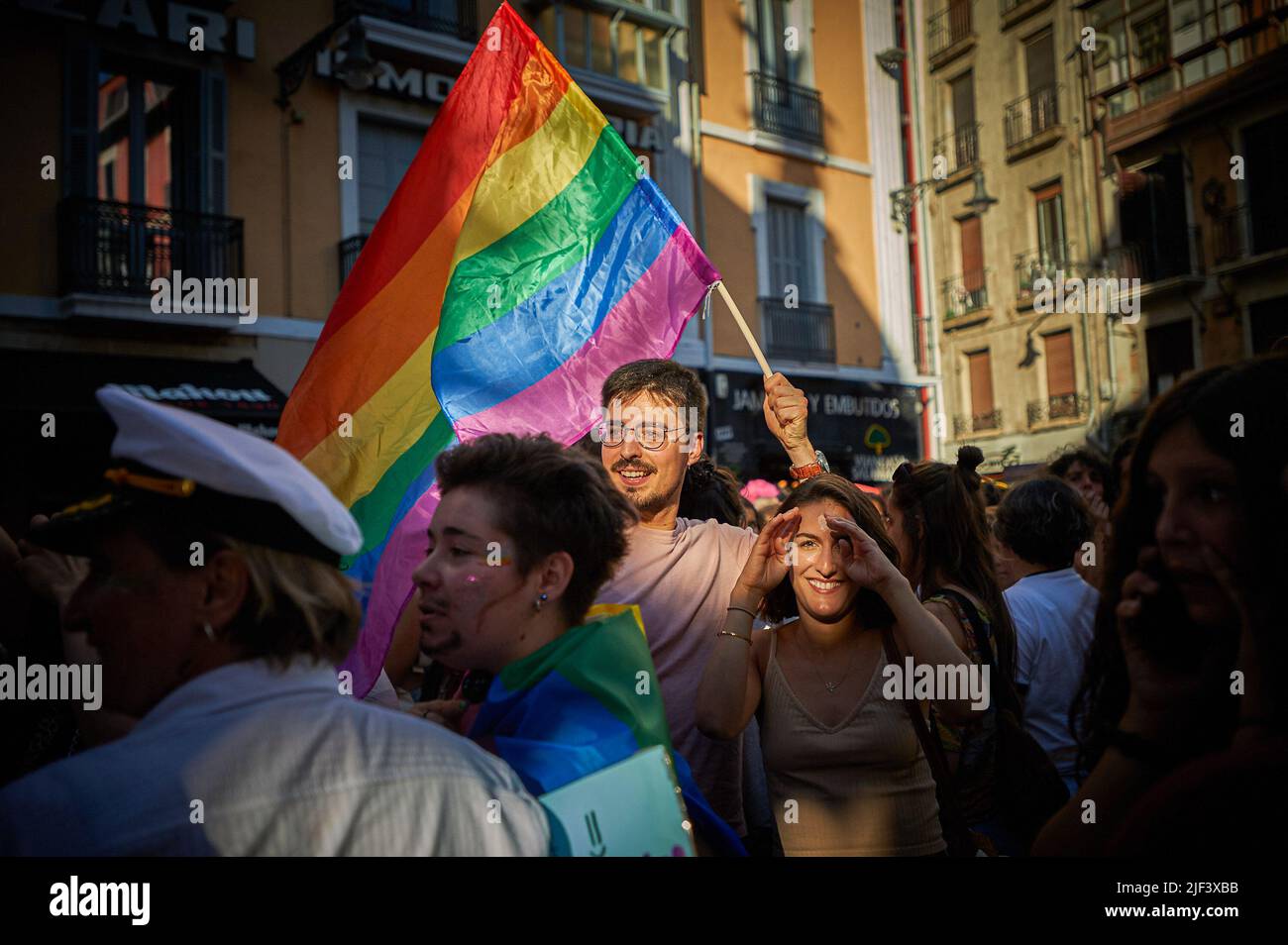 Pamplona, Spain. 28th June, 2022. Demonstrators celebrate with flags during the Gay Parade on the streets of Pamplona. Hundreds of people demonstrated through the streets of Pamplona, on the occasion of the celebration of Gay Pride, drag queens, flags flowed on the streets in vindication of the rights of the LGTBQ   collective. (Photo by Elsa A Bravo/SOPA Images/Sipa USA) Credit: Sipa USA/Alamy Live News Stock Photo