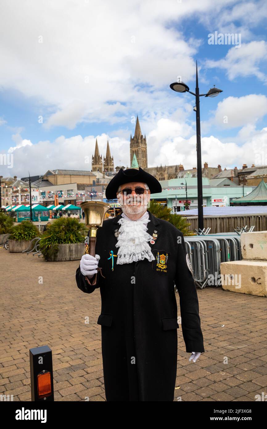 Truro, UK,29th June 2022,Town Crier, Lionel Knight poses with his bell while waiting for coaches to arrive on Market Day in Truro, Cornwall. The forecast is for sunshine, 16C and a gentle breeze.Credit: Keith Larby/Alamy Live News Stock Photo