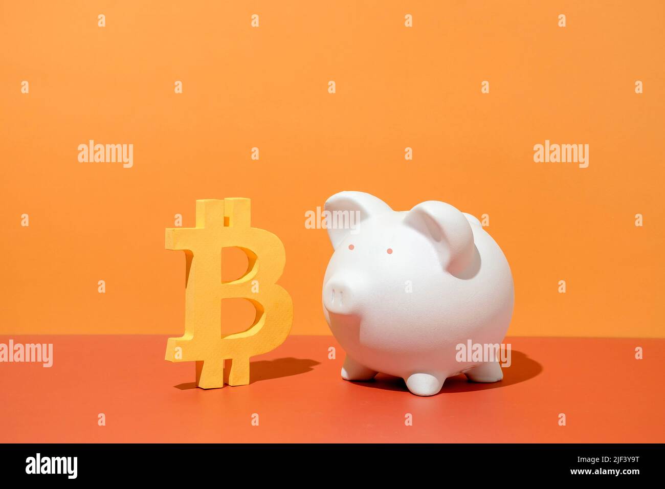 Bitcoin digital virtual mining money and piggy bank. Minimal creative concept of crypto business success and financial investment risk. Stock Photo