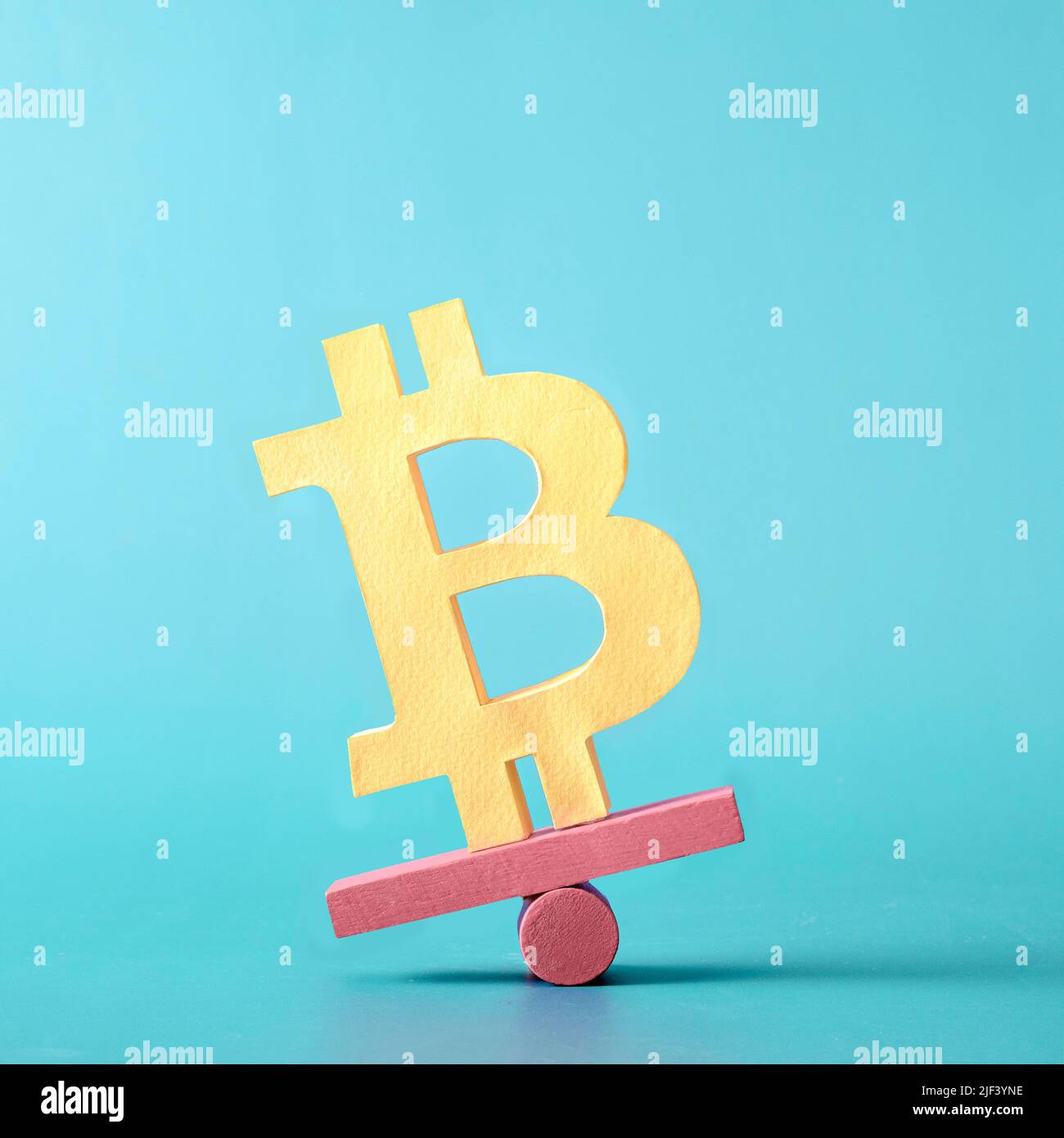 Bitcoin finance crypto money and virtual internet currency balances on a plane. Minimal trend creative concept of problems and success and loss and pr Stock Photo