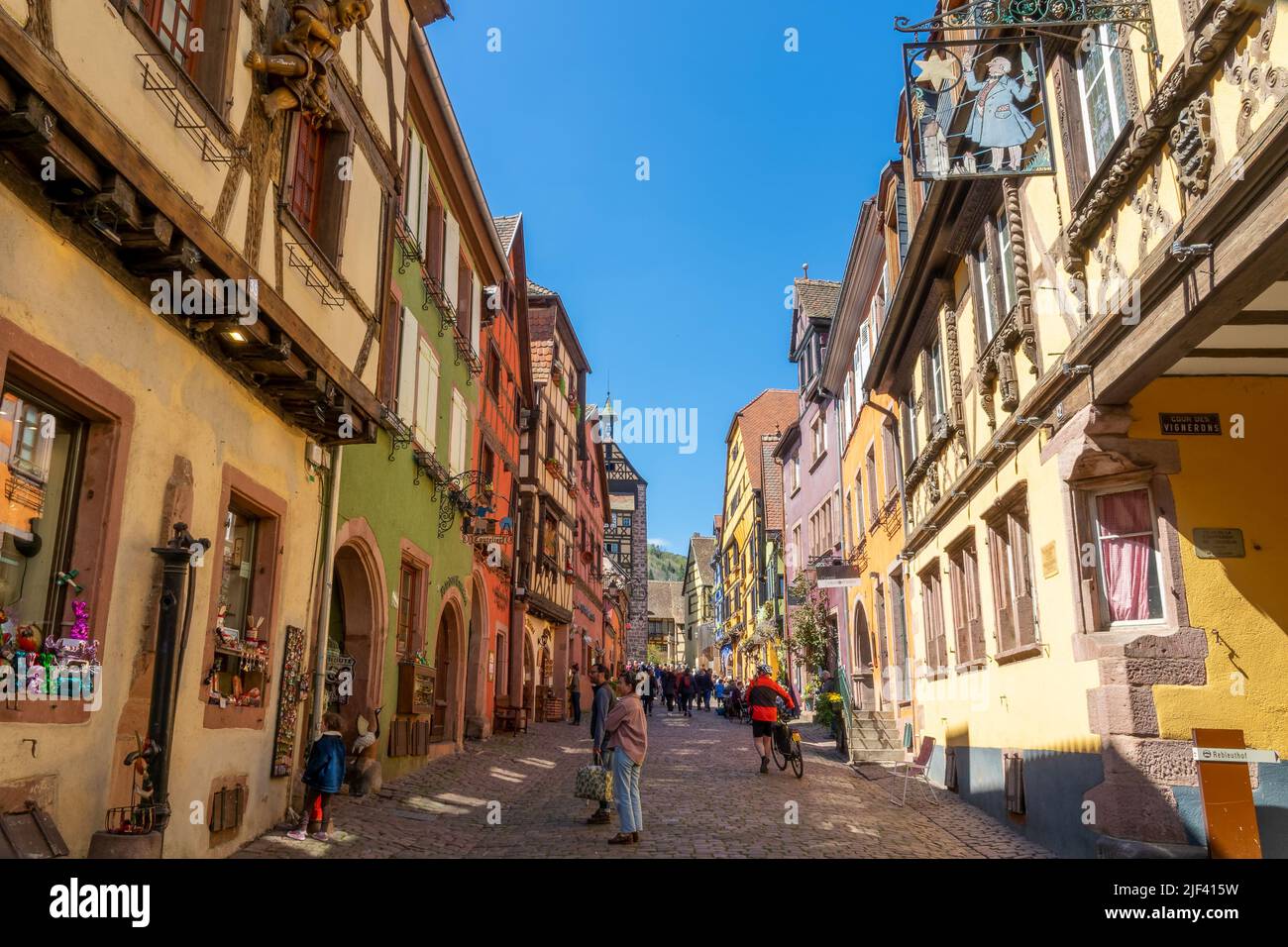 Colorful alsatian houses in the touristic village of Riquewihr in Alsace region, France Stock Photo