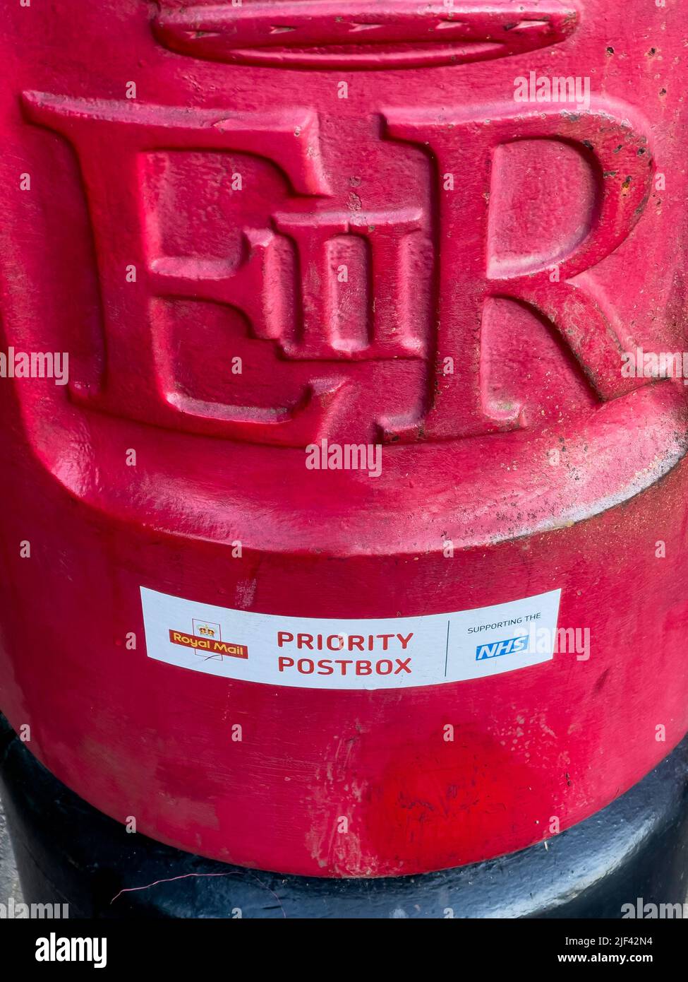 Closeup of a Royal Mail priority postbox for NHS, UK Stock Photo