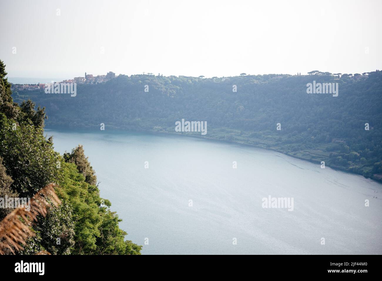 Panoramic view on green Alban hills overlooking volcanic crater lake Nemi, Castelli Romani, Italy in summer, travel in Italy Stock Photo
