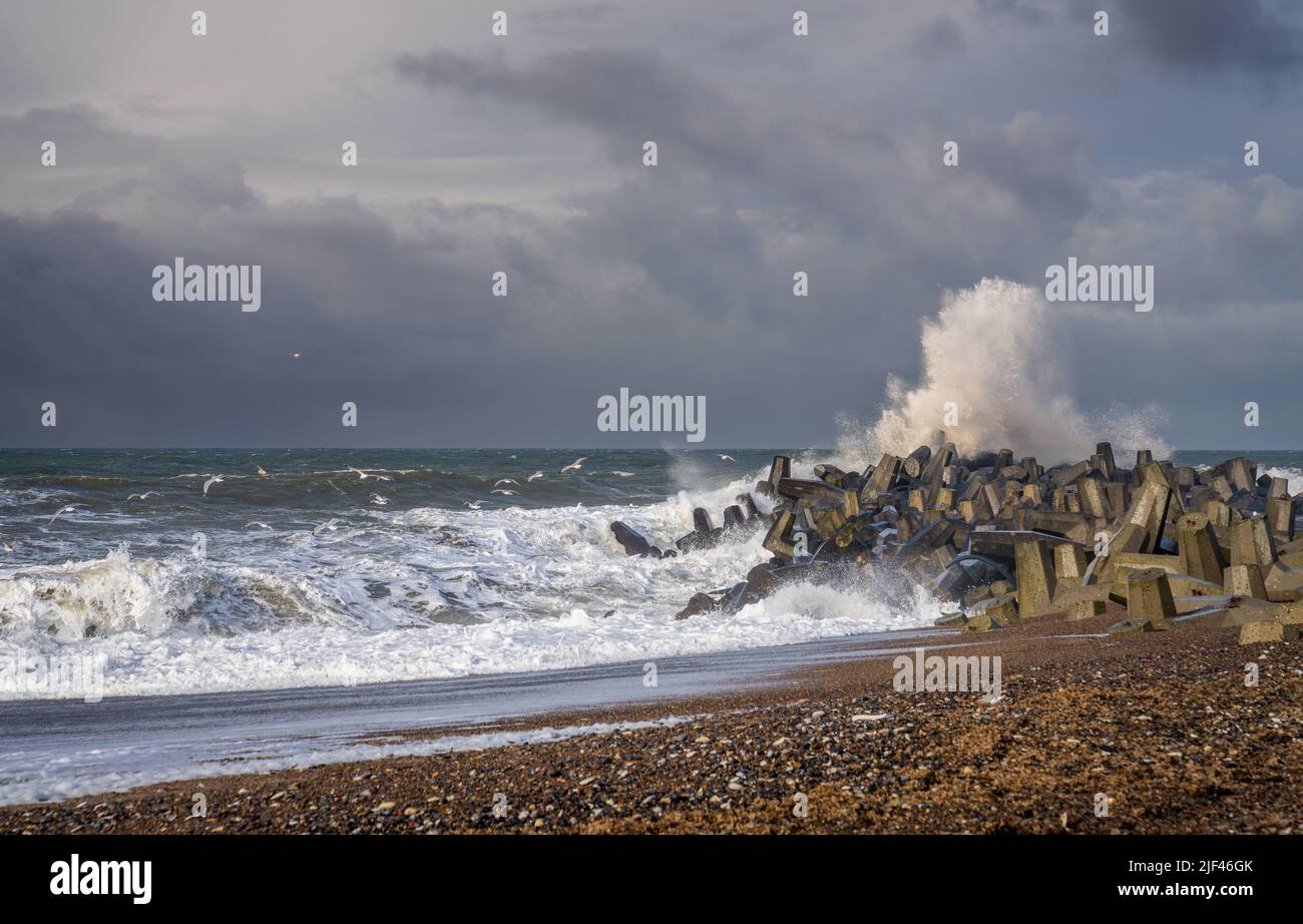 The view of ocean waves hitting the rocky shore in stormy weather Stock ...