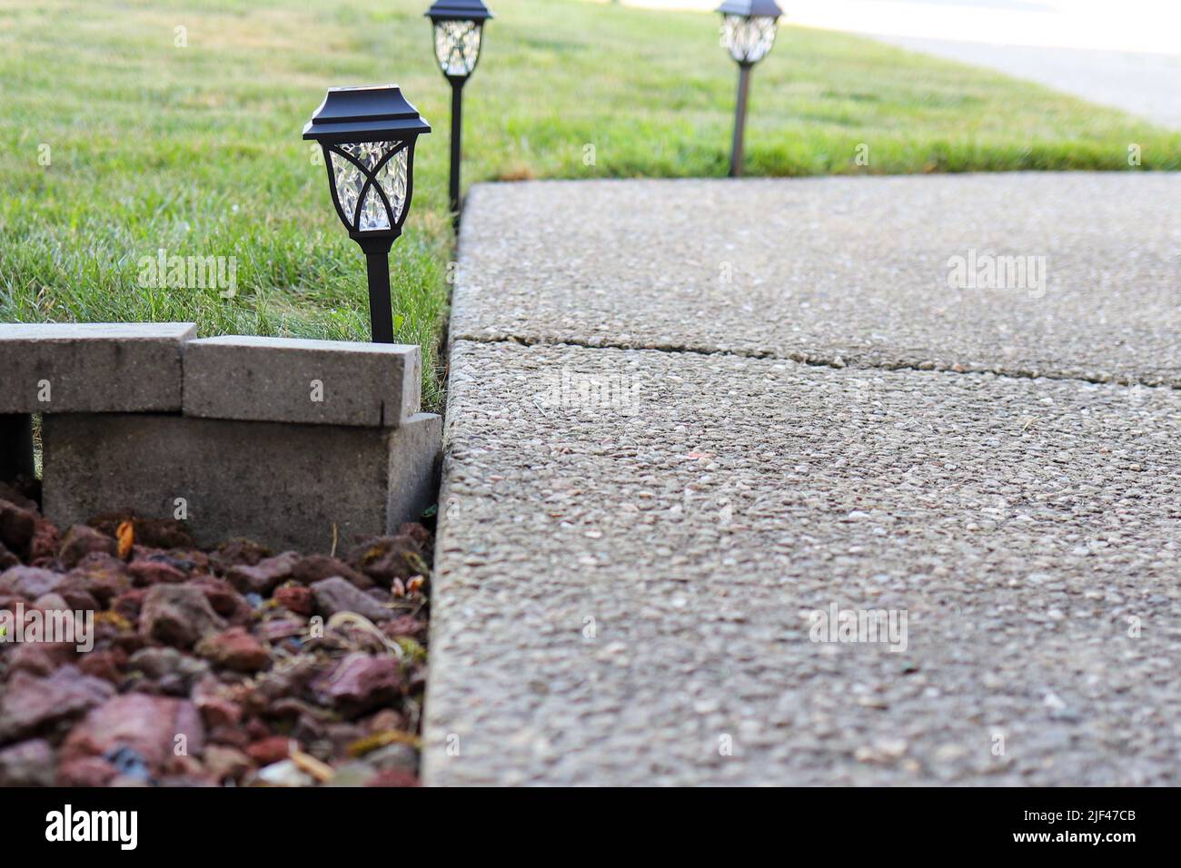 Close up of solar landscaping lights in a lawn Stock Photo
