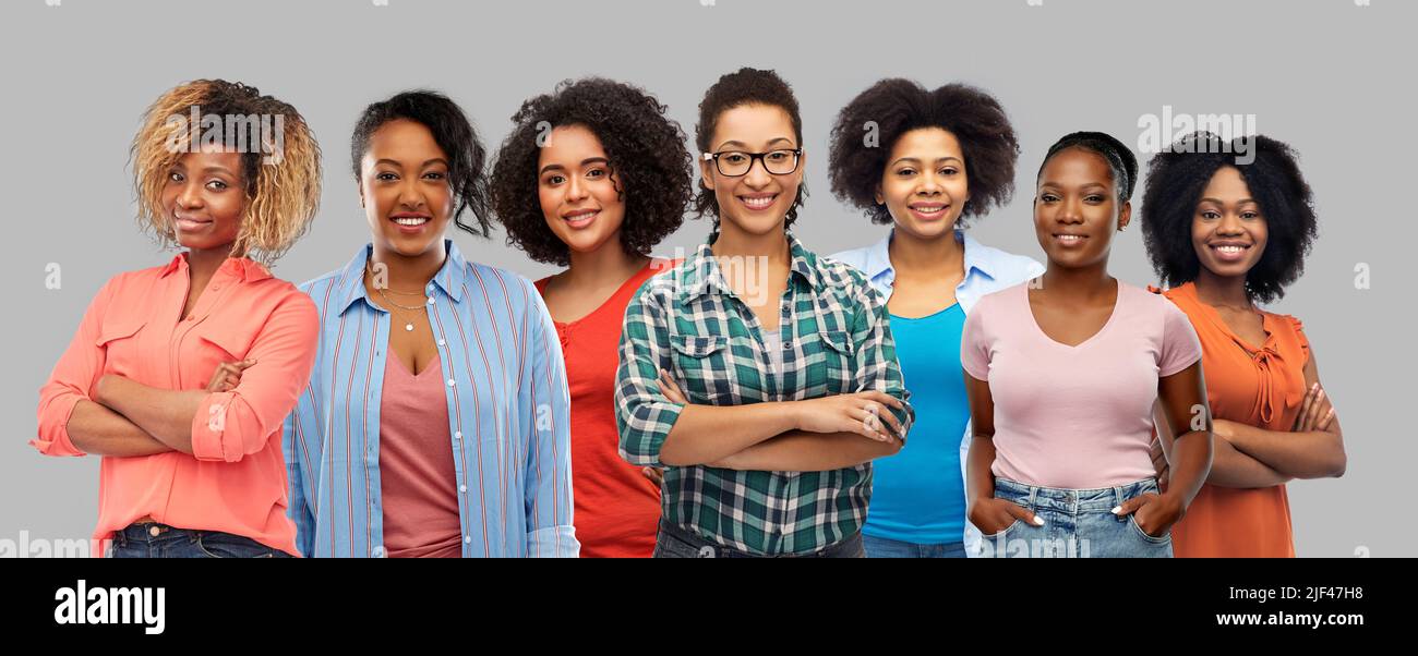 happy african american women over grey background Stock Photo - Alamy