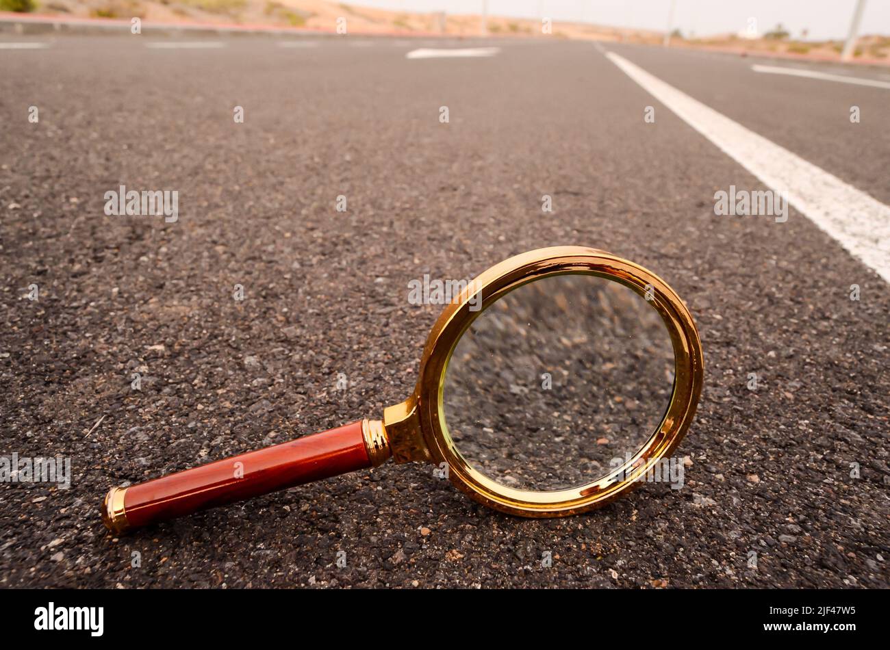 Travel Concept Magnify Glass Loupe on the Asphlat Road Stock Photo Alamy