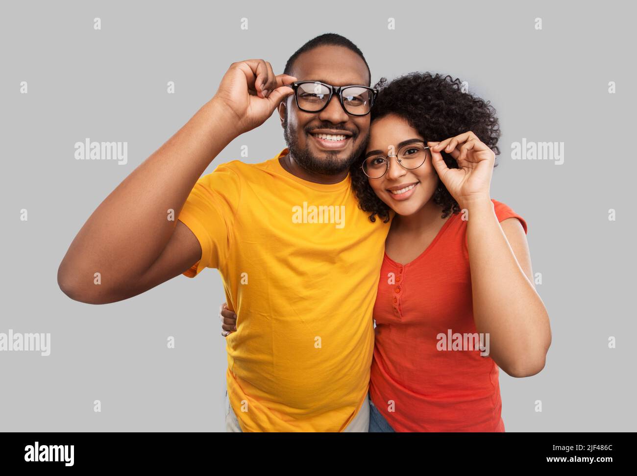 happy african american couple in glasses hugging Stock Photo - Alamy