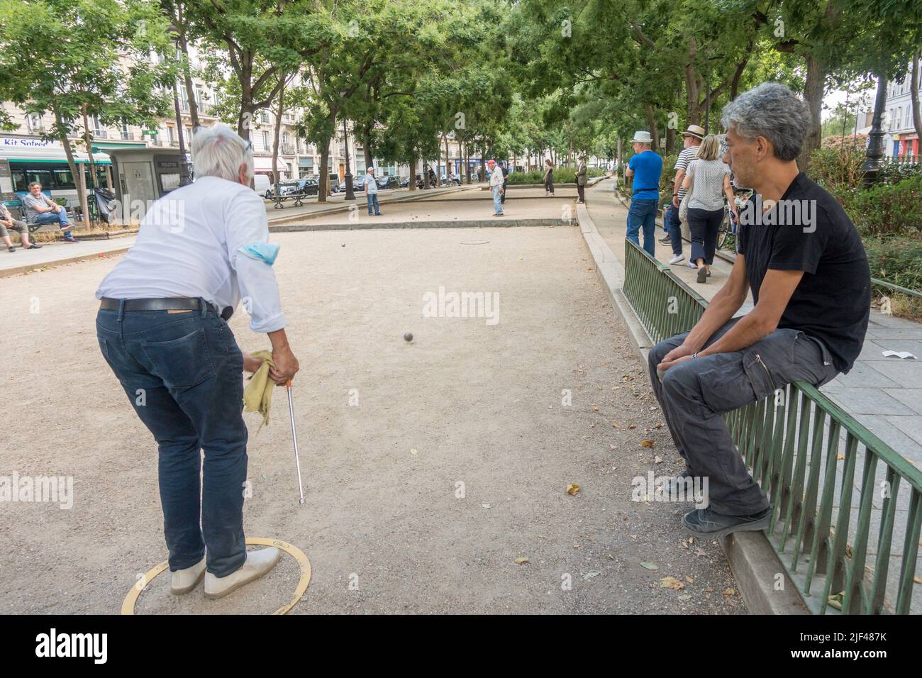 Men playing jeu de boules or petanque at Chemin vert, Paris, France. Stock Photo