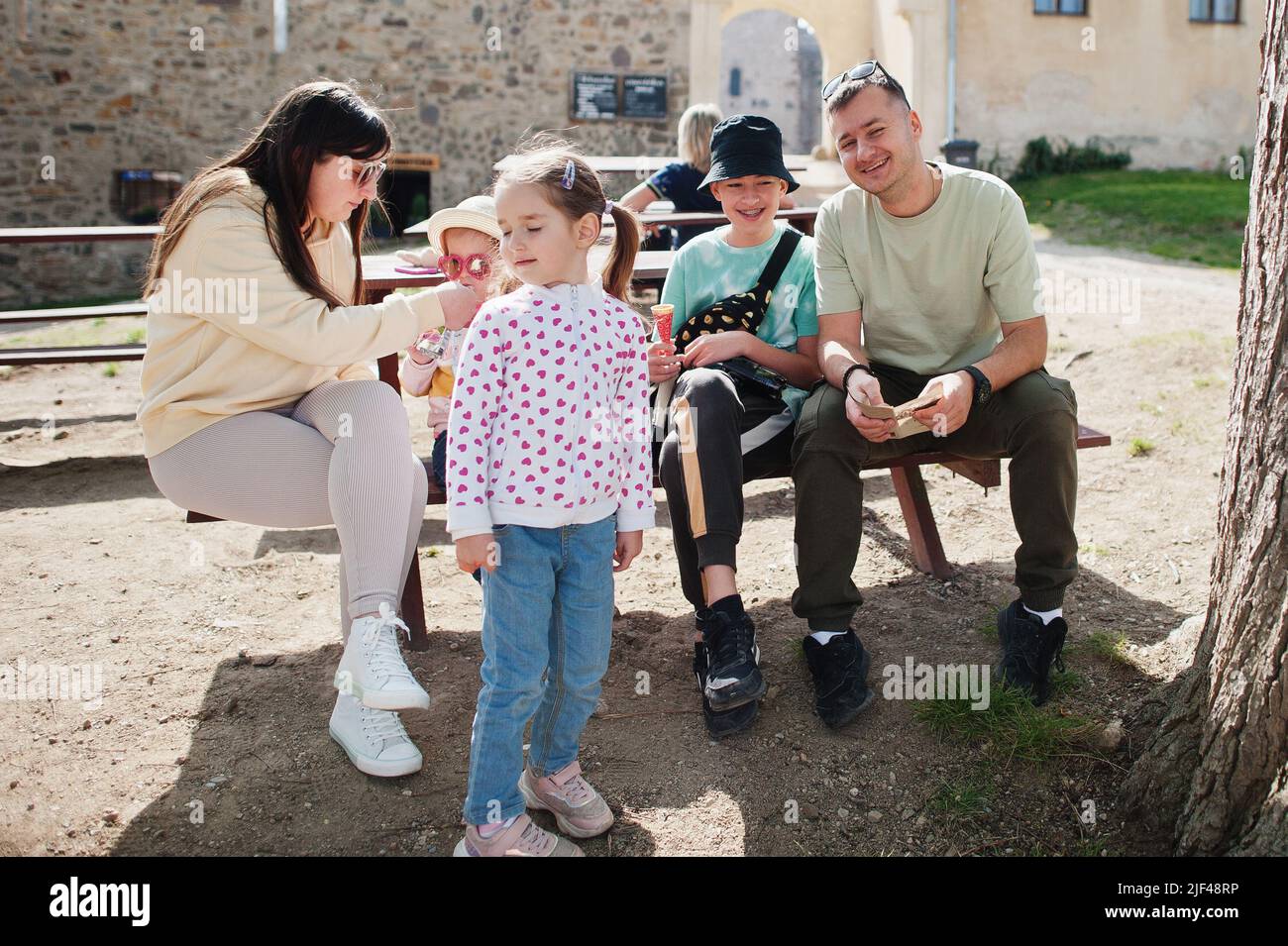 Family sitting at table in Veveri castle, Czech Republic. Stock Photo