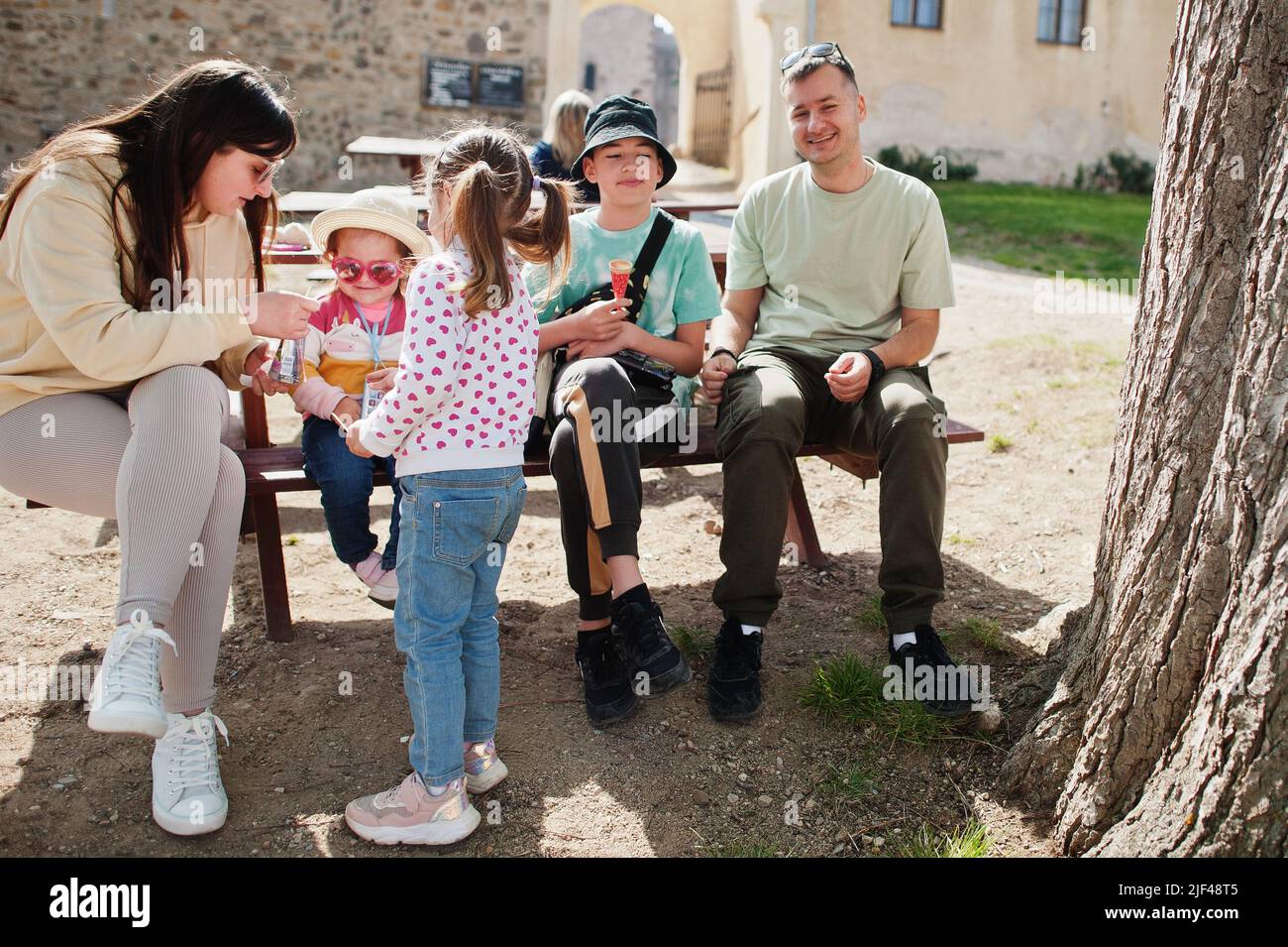 Family sitting at table in Veveri castle, Czech Republic. Stock Photo