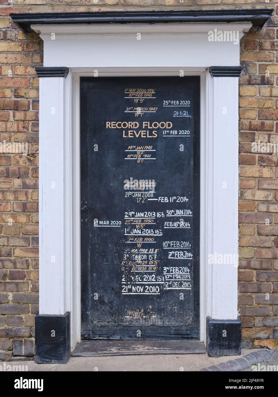 Historical flood marks on  door at the Boat Inn, Coalport, Shropshire Stock Photo