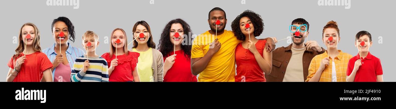 group of happy smiling people with red clown noses Stock Photo