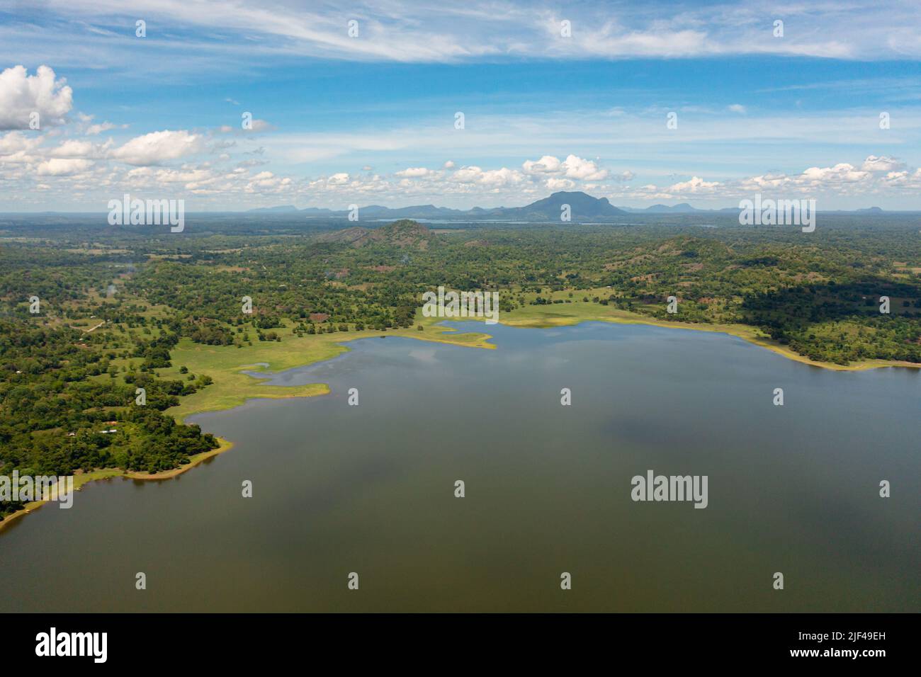 Aerial view of Sorabora lake in sri lanka with wooded hills. Lakeside