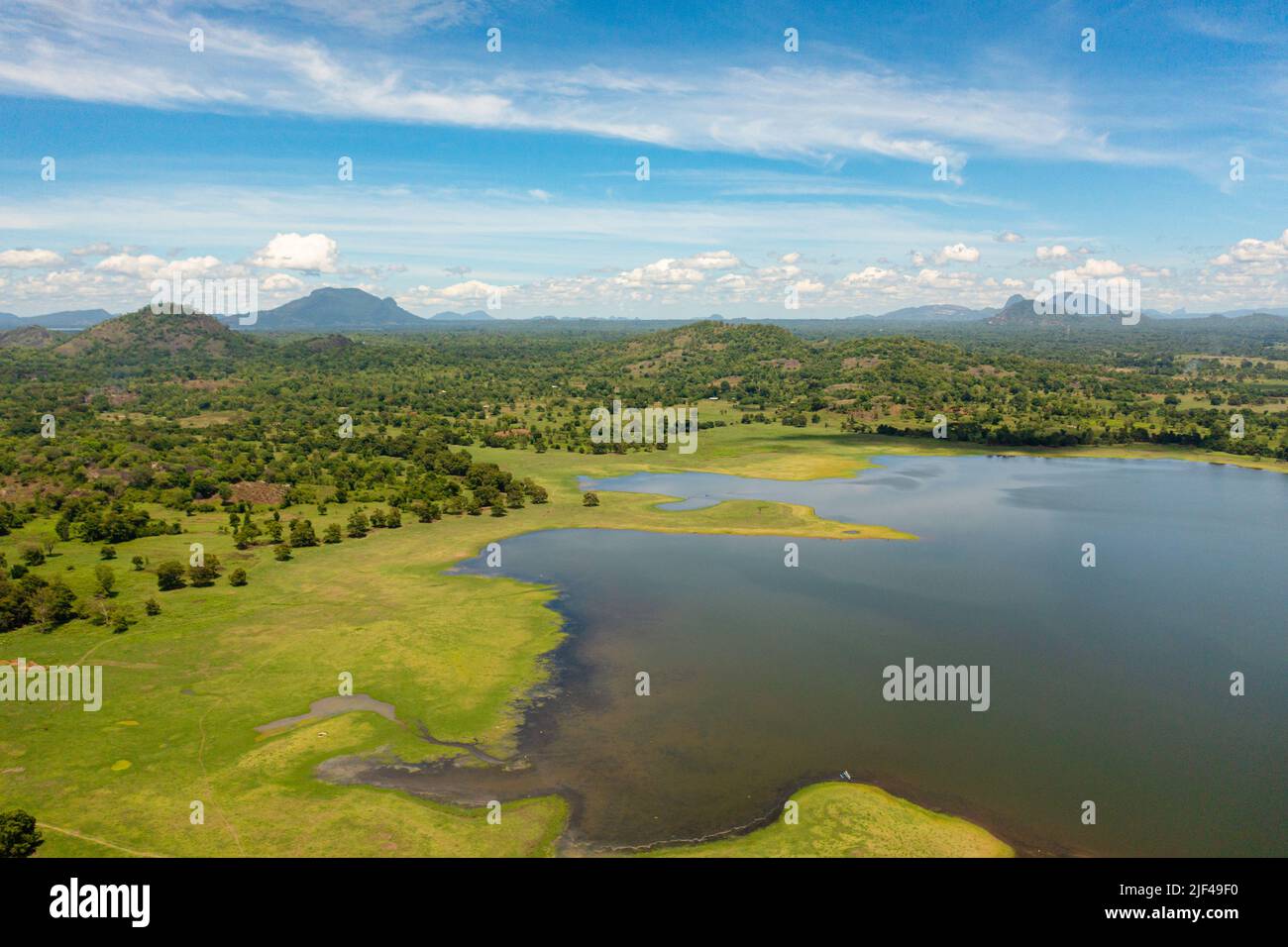 Beautiful Sorabora lake among hills with tropical vegetation. Sri Lanka