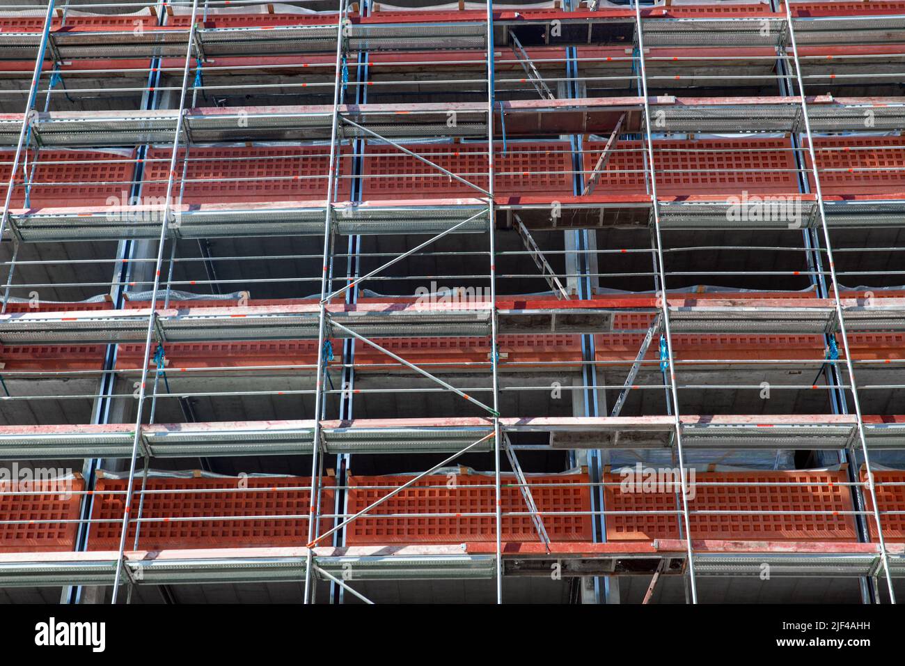 building under construction with scaffolding Stock Photo - Alamy