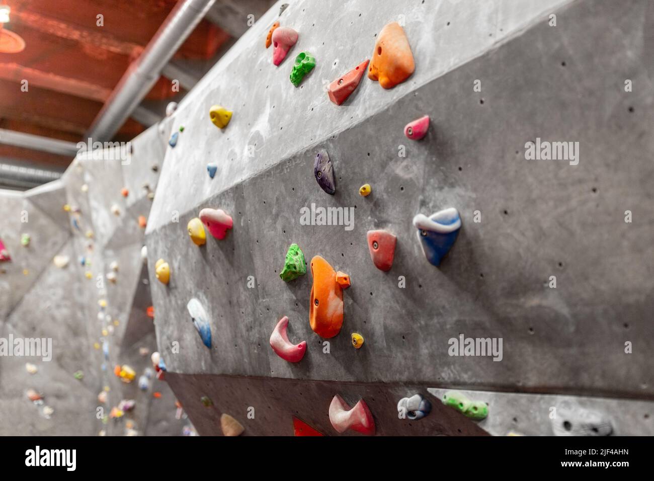 indoor climbing wall in gym Stock Photo