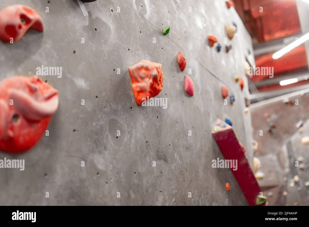 indoor climbing wall in gym Stock Photo