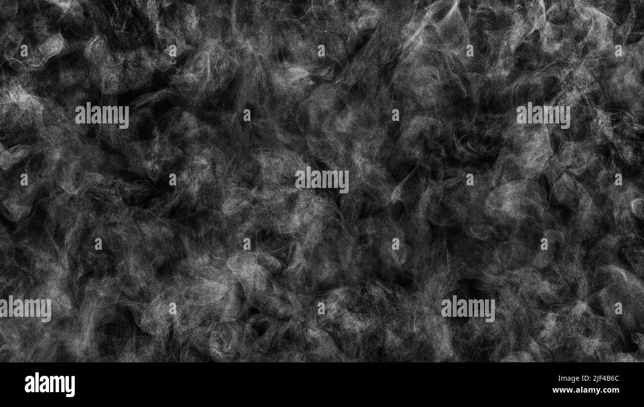 Very small drops of steam in chaotic motion on black. Texture background Stock Photo
