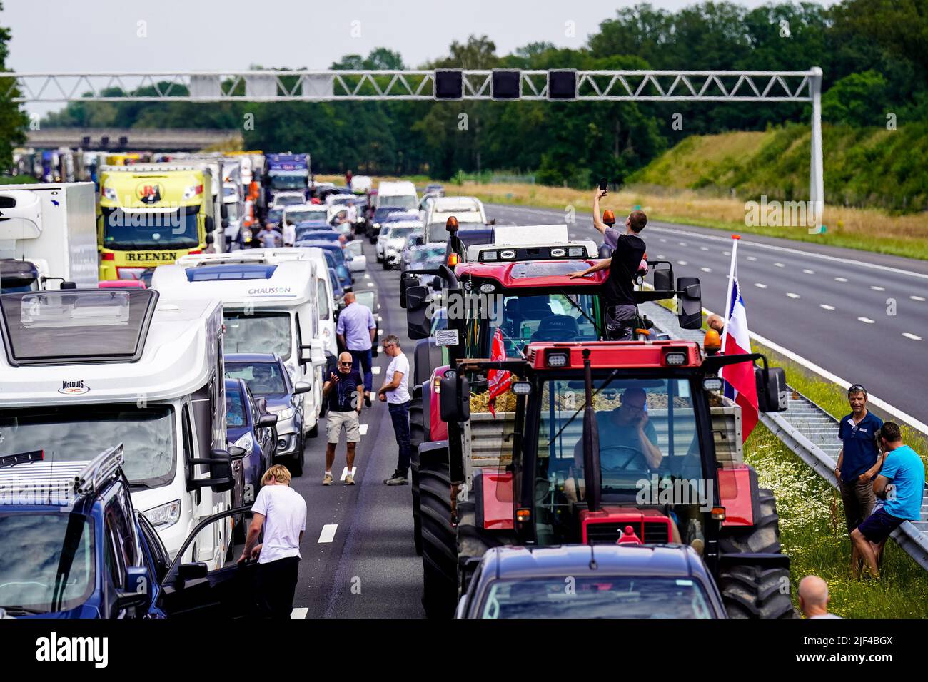 RIJSSEN, NETHERLANDS JUNE 29 People are waiting outside their cars