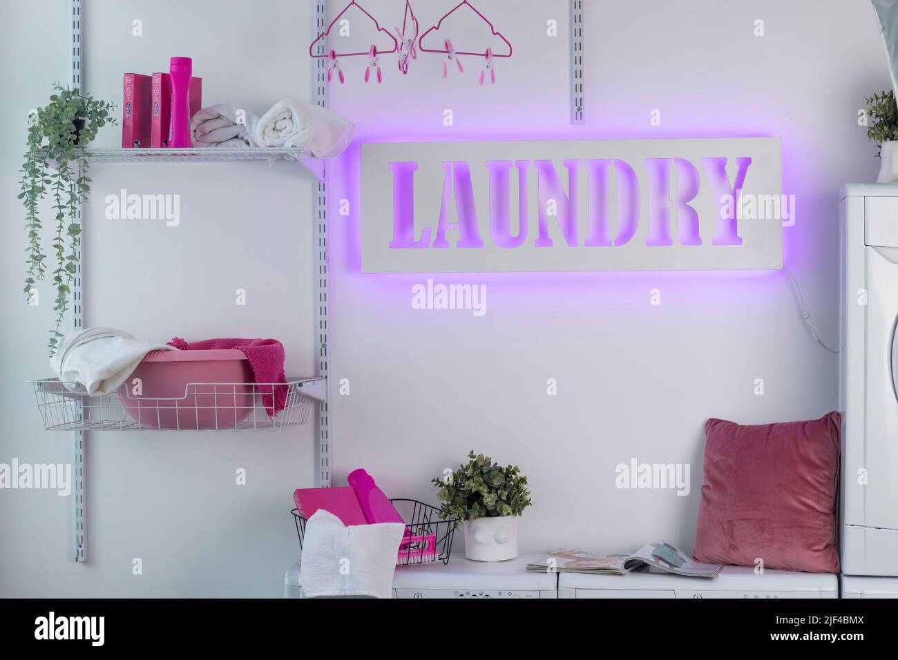 Glowing neon laundry sign on a white background. Illuminated signboard ...