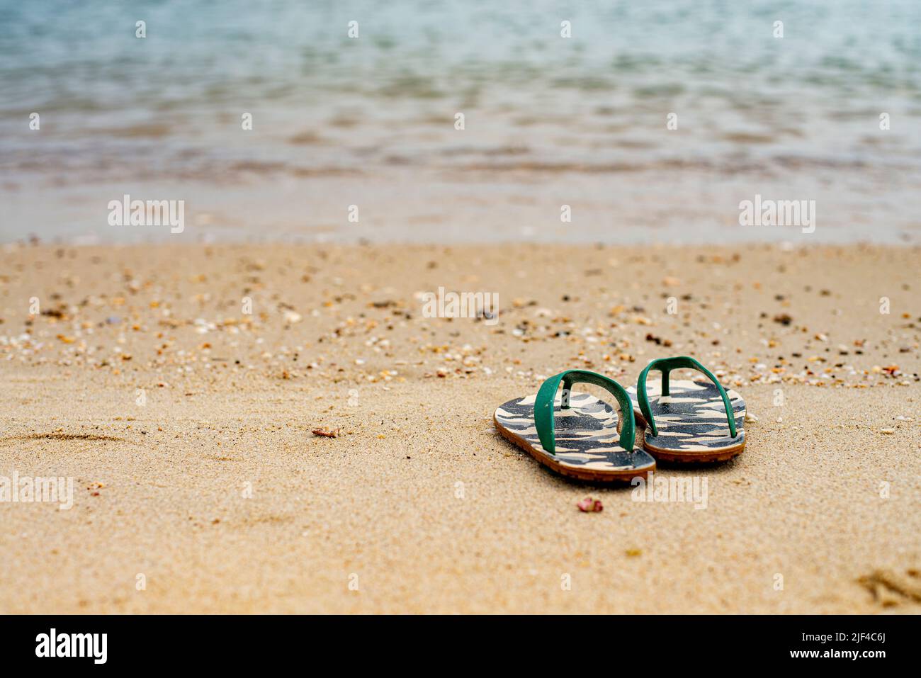 Flip Flops on a sandy ocean beach , Summer vacation concept Stock Photo ...