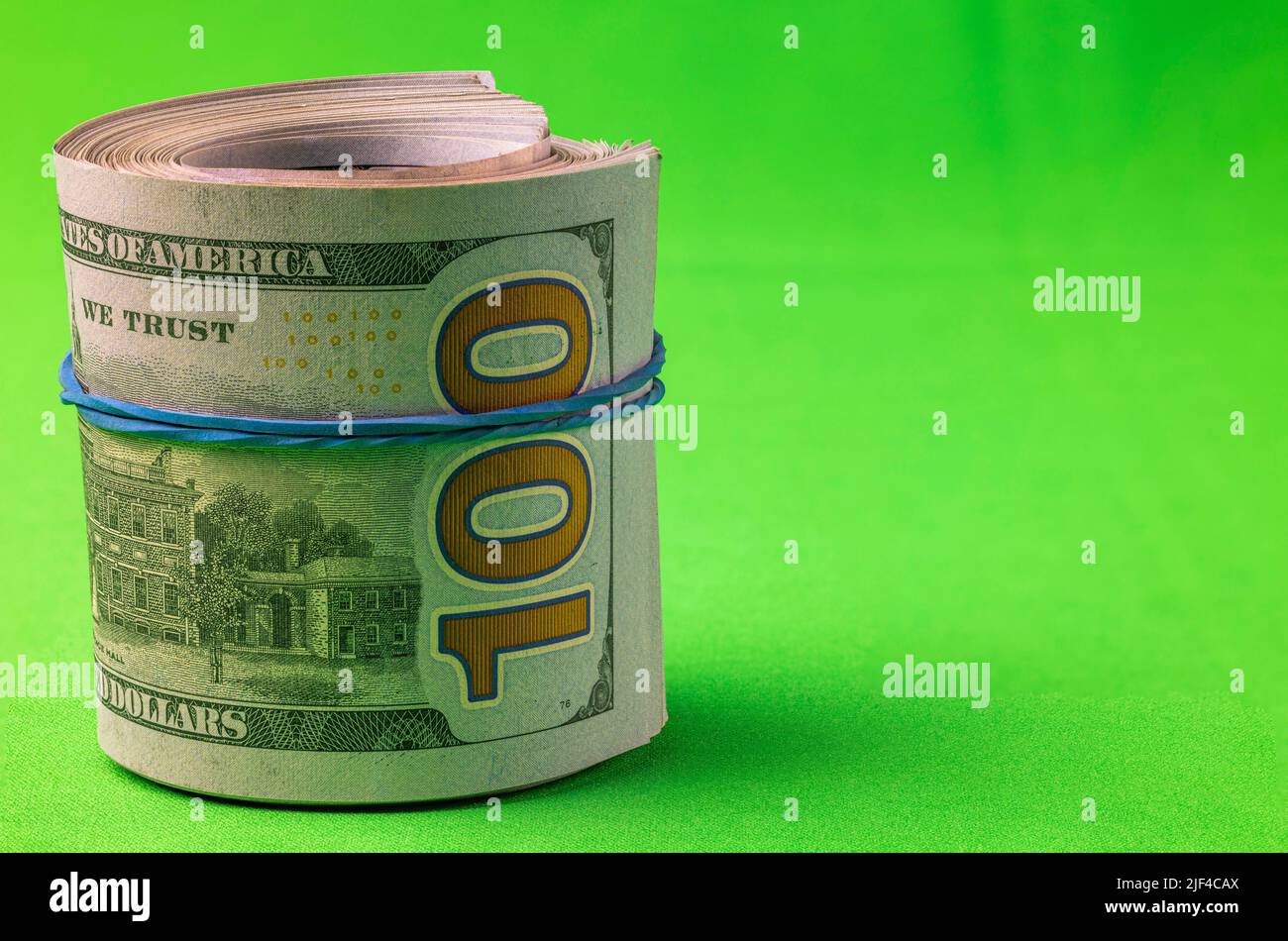 View of 100 dollar bills rolled into roll isolated on chrome key ...