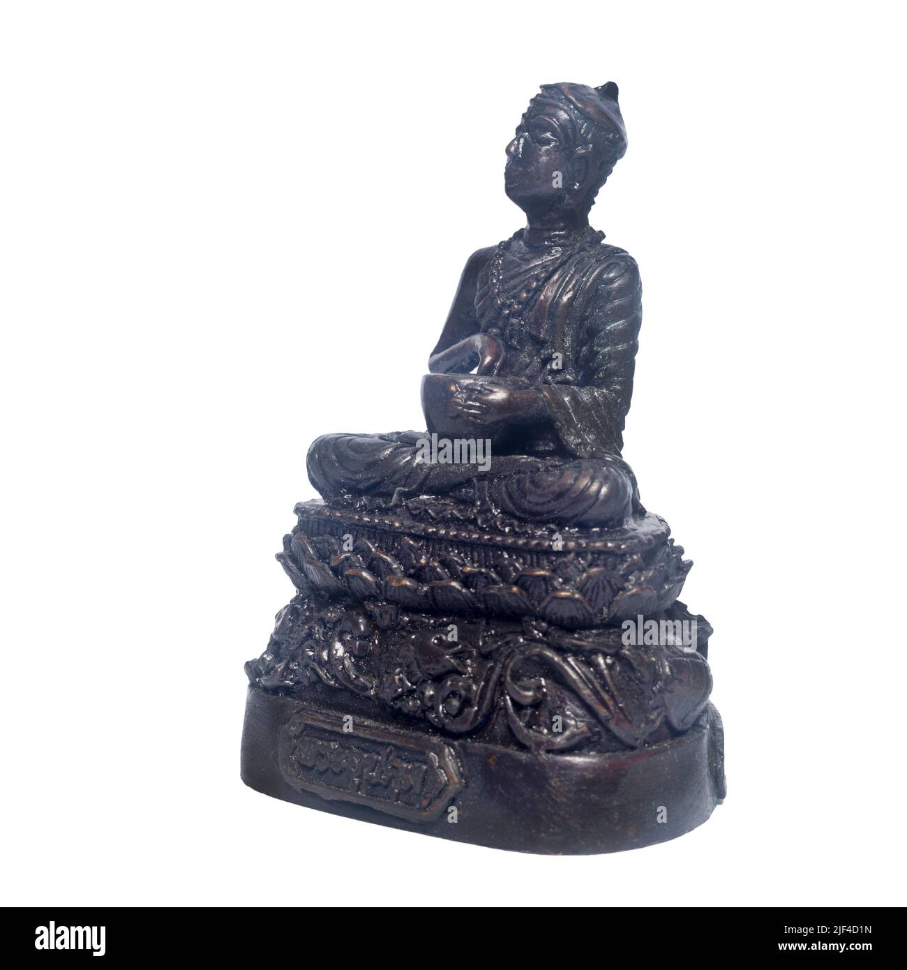 Old Buddha statue isolated on a white background. Name of Buddha statue is Upagupta . Stock Photo