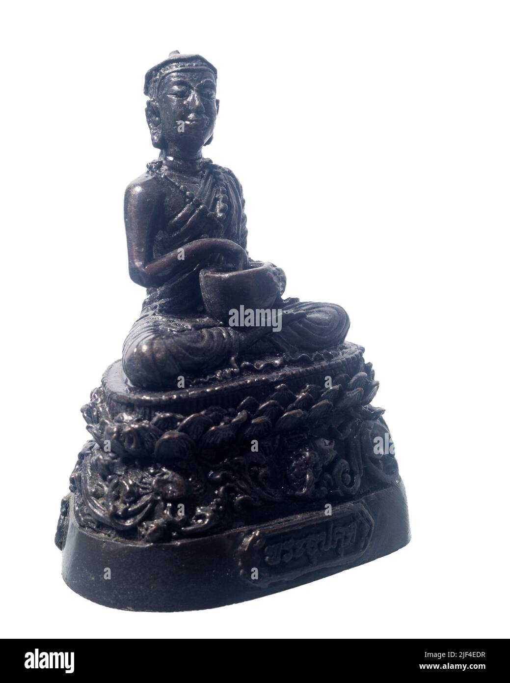 Old Buddha statue isolated on a white background. Name of Buddha statue is Upagupta . Stock Photo