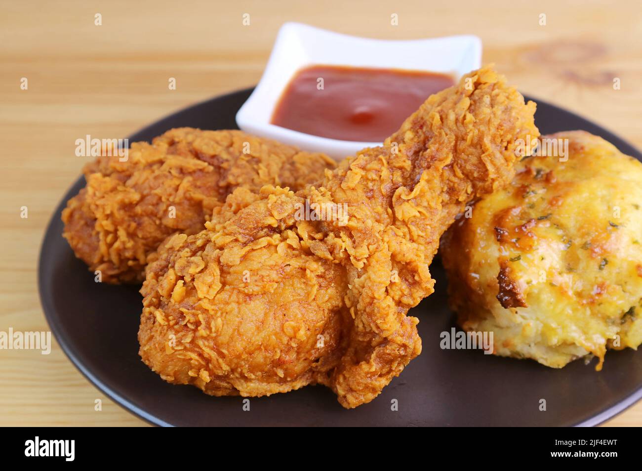Closeup of Crispy Golden Brown Fried Chicken Drumsticks with Herb